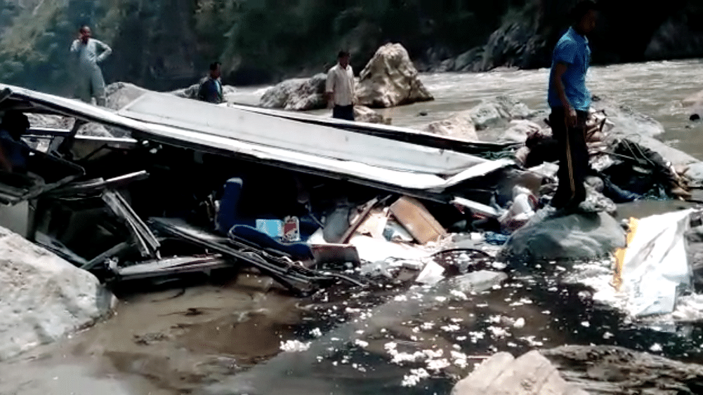 A view of the private bus that crashed into the Tons River in Shimla, killing at least 43 people. (Photo Courtesy: Video screengrab)