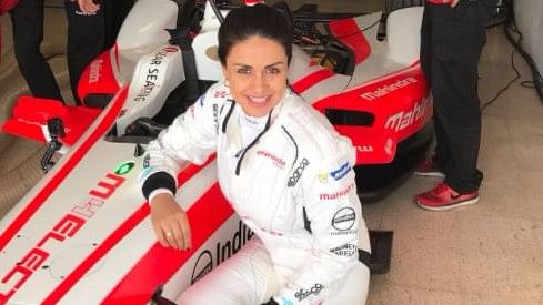 Gul Panag poses with the Formula E racing car in Barcelona, Spain. (Photo Courtesy: <a href="https://twitter.com/PD_Official">Twitter/@PD_Official</a>)