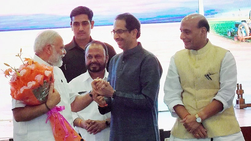 PM Narendra Modi and BJP President Amit Shah’s dinner diplomacy was held at Delhi’s Pravasi Kendra on Monday evening. (Photo: PTI)