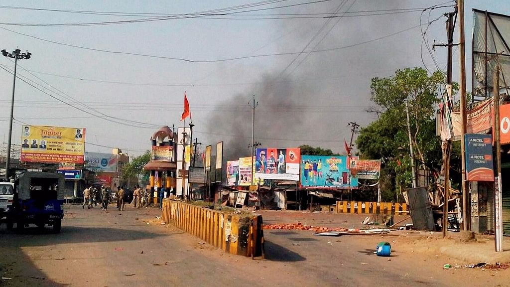 Security personnel patrolling a Nawada street after communal tension were triggered by torn religious posters on the eve of Ram Navami. (Photo: PTI)