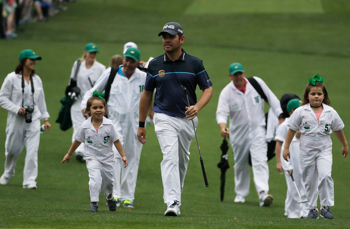 Weather played spoilsport during the Par 3 Contest, but the golfers managed to get on the course with their kids.