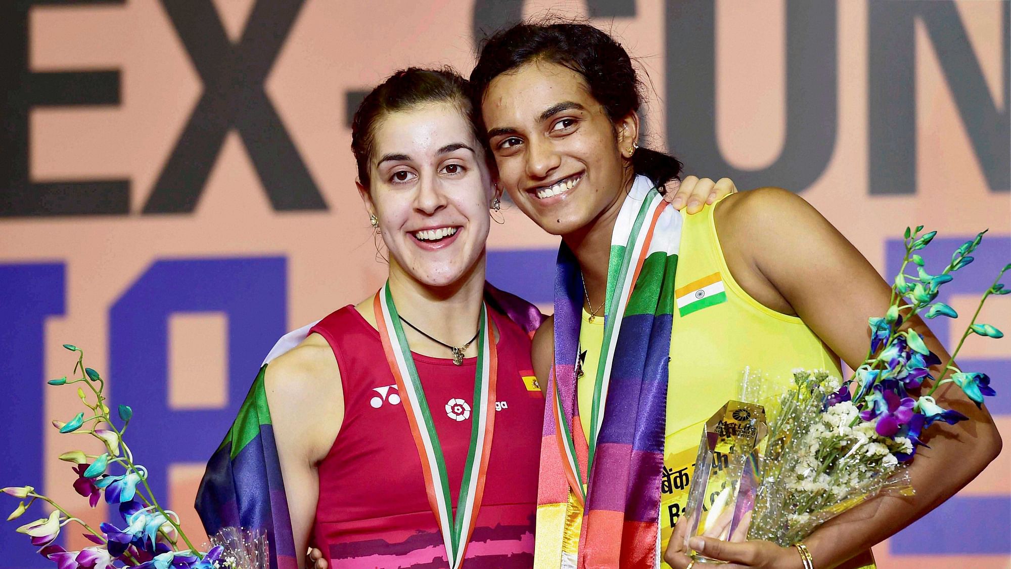 PV Sindhu with Carolina Marin on the podium after the India Open Super Series match. (Photo: PTI)