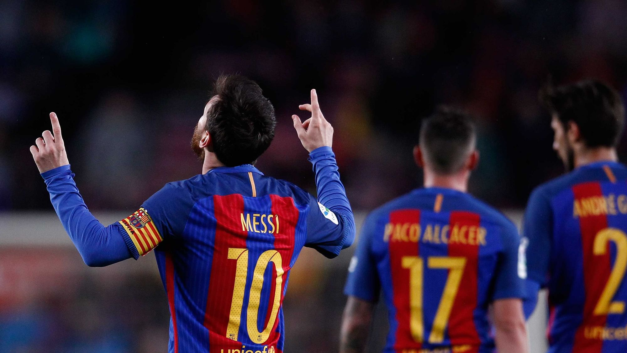 FC Barcelona’s Lionel Messi, left, celebrates after scoring during the Spanish La Liga soccer match between FC Barcelona and Osasuna at the Camp Nou. (Photo: AP)