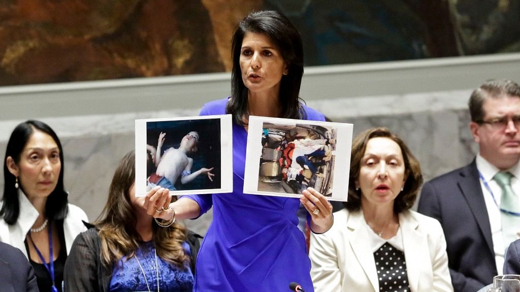 

Nikki Haley shows pictures of Syrian victims of chemical attacks at UN headquarters. (Photo: AP)