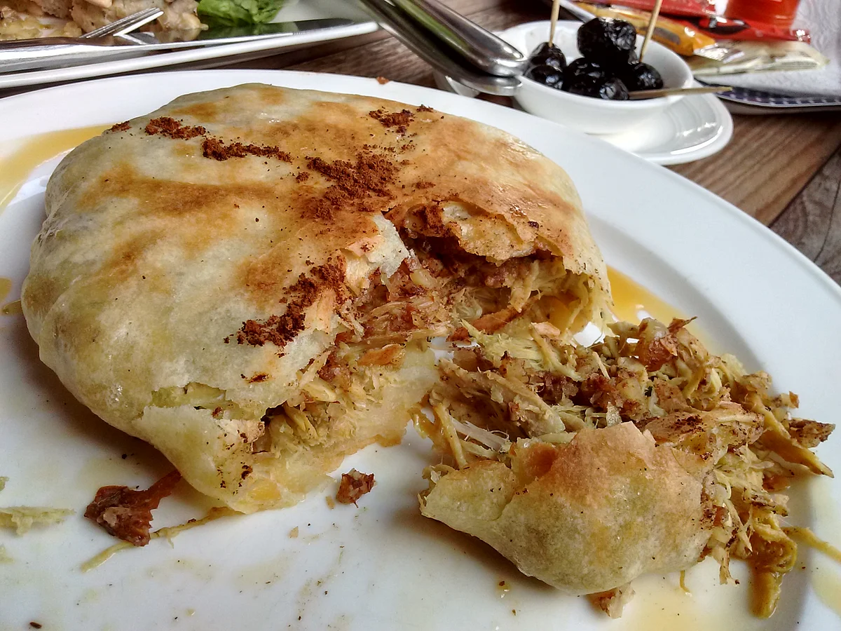A chicken pastilla garnished with cinnamon powder. (Photo: Suktara Ghosh)