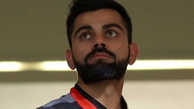 Virat Kohli looks on from the dressing roon as rain abandoned the match between Royal Challengers Bangalore and Sunrisers Hyderabad. (Photo: BCCI)