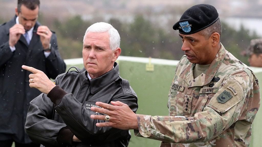 US Vice President Mike Pence, left, is briefed by US G Army general Vincent Brooks, right, commander of the United Nations Command, US Forces Korea and Combined Forces Command from Observation Post Ouellette in the Demilitarized Zone (DMZ). (Photo: AP)
