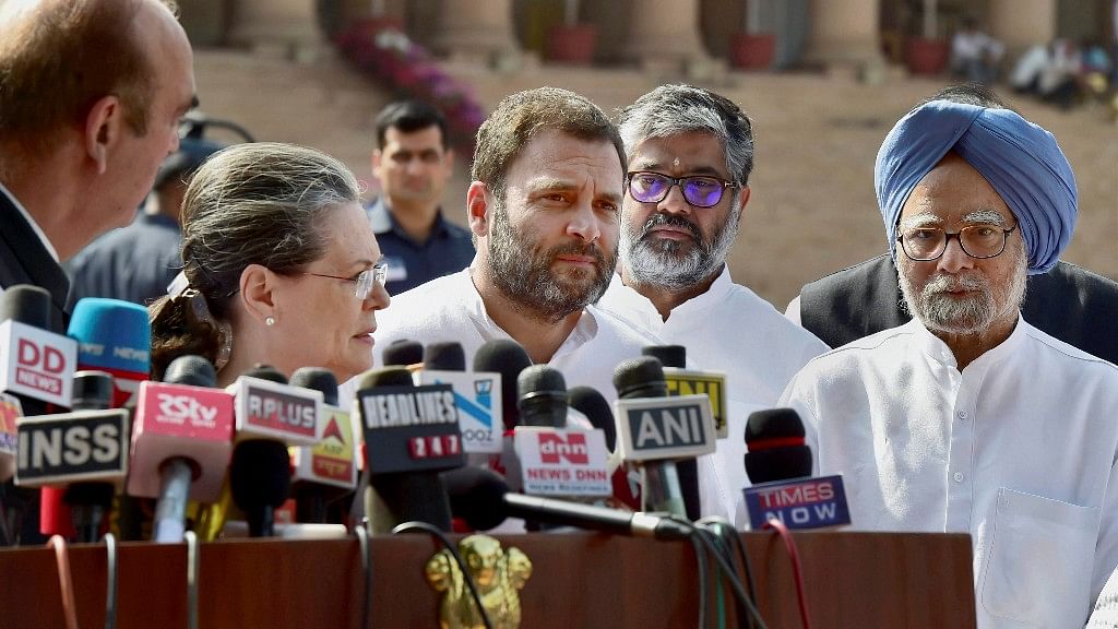 Congress leaders Sonia Gandhi, Rahul Gandhi and Manmohan Singh address the media outside Parliament House in New Delhi on Wednesday. (Photo: PTI) 