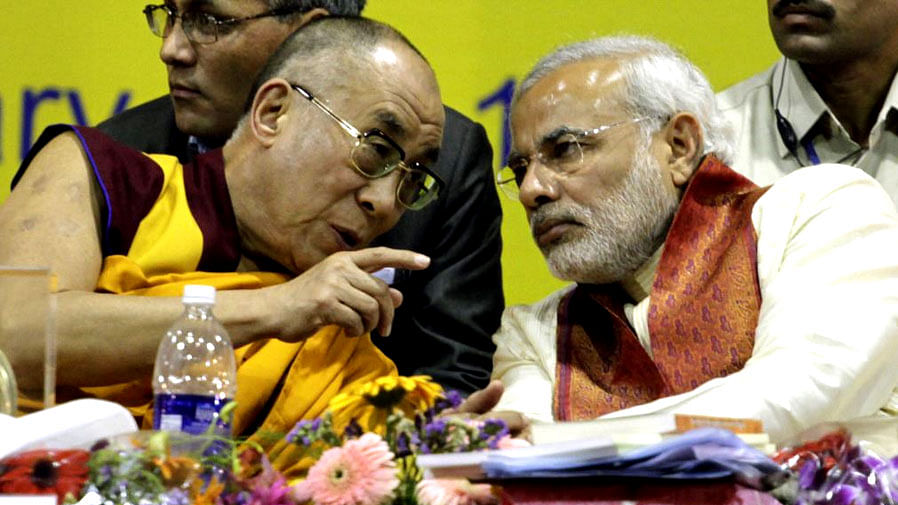Dalai Lama with Prime Minister Narendra Modi. (Photo Courtesy: Twitter/@<a href="https://twitter.com/prathibhatweets/status/673954679047327745">pratibhatweets</a>)