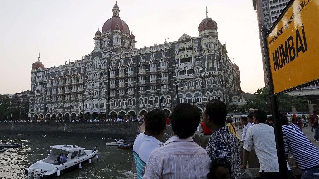 Tourists are seen in front of the Taj Mahal hotel, which was one of the targets of the November 26, 2008 attacks, in Mumbai April 10, 2015. (Photo: Reuters)