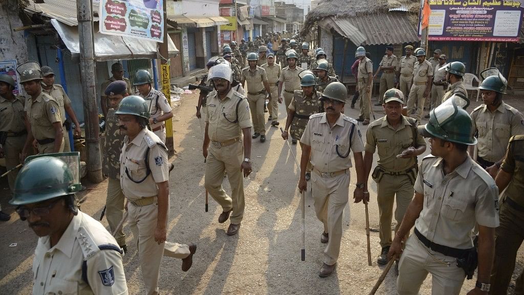 Security personnel conduct flag march in Odisha’s Bhadrak after communal tension erupted following a derogatory Facebook post on 9 April 2017. (Photo: IANS)