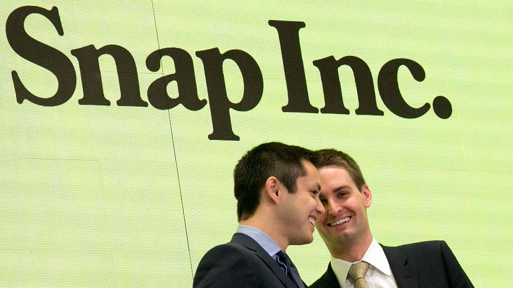 A file photo of Snapchat co-founders Bobby Murphy, left, and Evan Spiegel ringing the opening bell at the New York Stock Exchange.&nbsp;