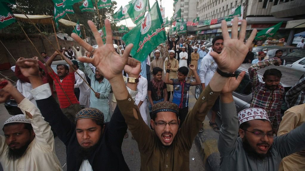 Supporters of a religious political party shout slogans during a demonstration against the sentence of convicted killer Mumtaz Qadri in Karachi in 2015. Qadri was convicted for killing Pakistani Governor Salman Taseer for supporting the repeal of the country’s blasphemy laws. (Photo: Reuters/Athar Hussain)