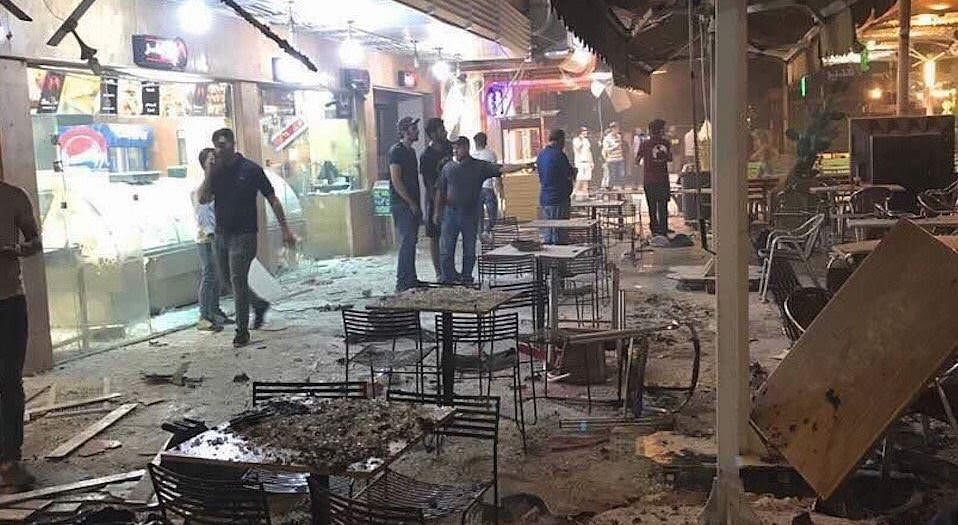 A car bomb exploded outside a popular ice cream shop in central Baghdad just after midnight.