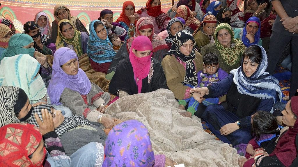 

Kulgam: Jammu and Kashmir Chief Minister Mehbooba Mufti visits the family of JK Bank employee who was killed by the suspected militants during thier cash van loot. (Photo: PTI)