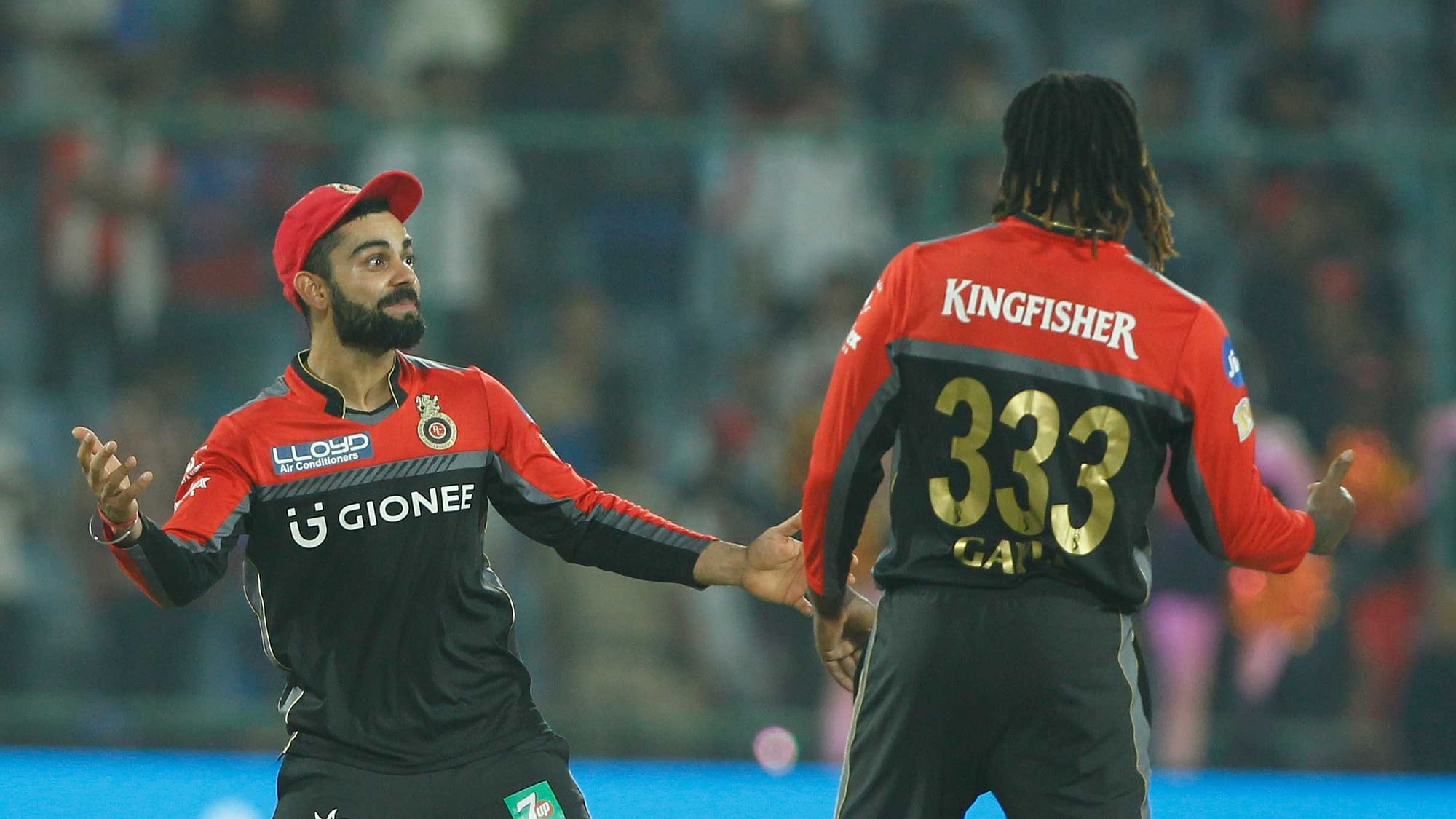 Virat Kohli and Chris Gayle celebrate the team’s win. (Photo: BCCI)