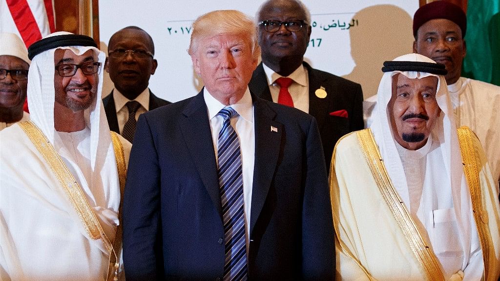 President Donald Trump poses for photos with King Salman and others at the Arab Islamic American Summit, at the King Abdulaziz Conference Center. (Photo: AP)