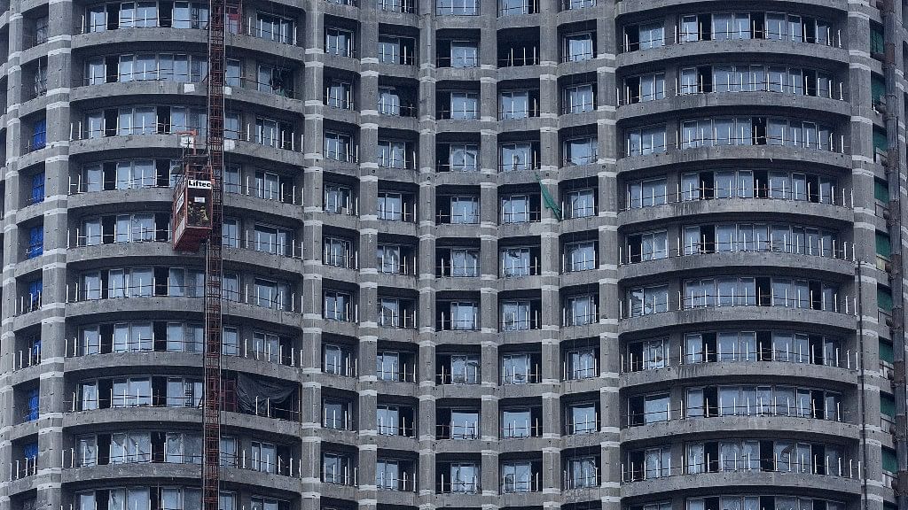 
















Workers take a lift at an under-construction high-rise residential tower
in central Mumbai. (Picture: Reuters)