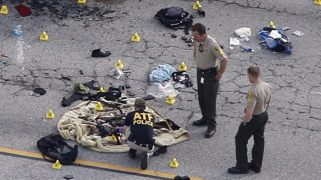 File photo of law enforcement officers looking at the evidence near the remains of an SUV involved in the San Bernardino attack, California. (Photo: Reuters)