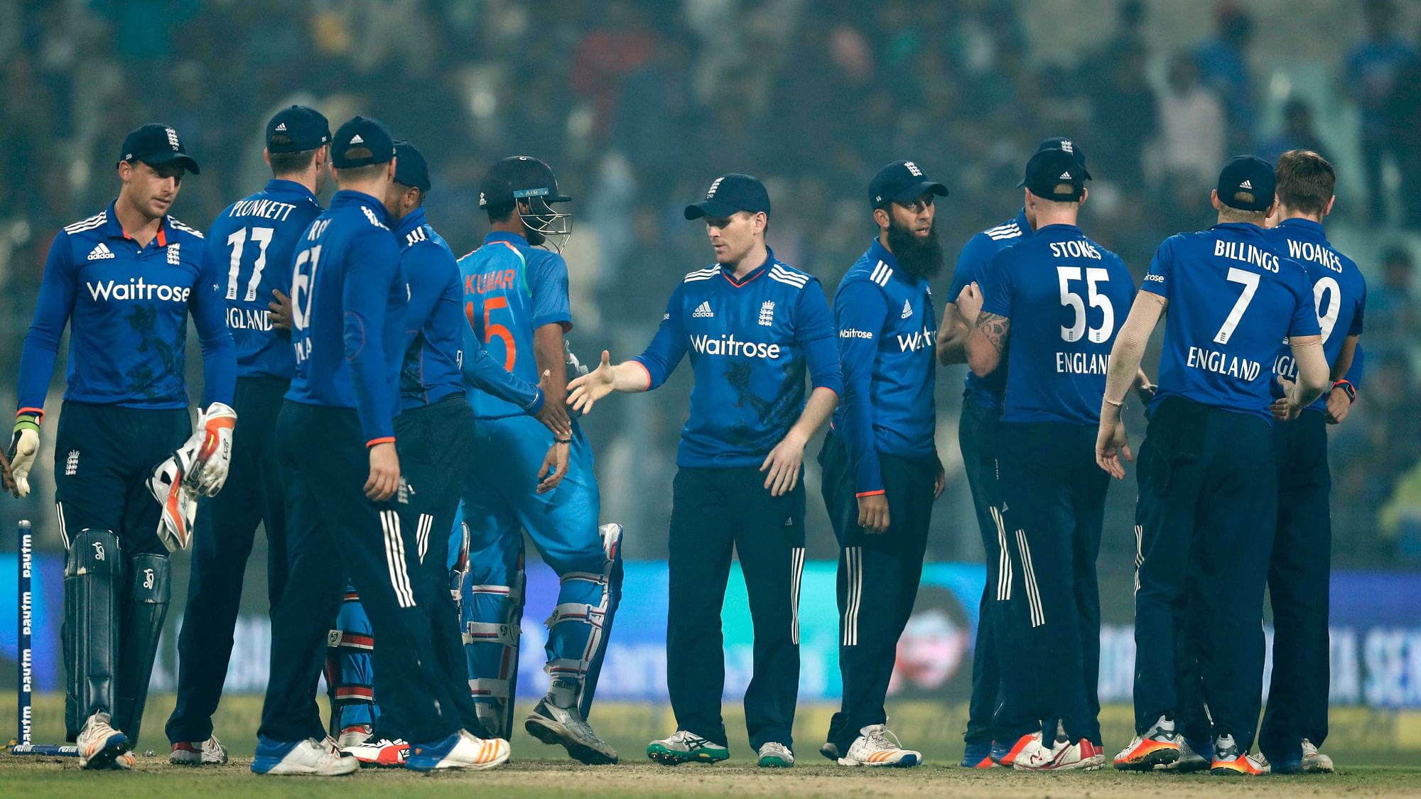 The English cricketers shake hands with their Indian counterparts after an ODI in India earlier this year.  (Photo: AP)