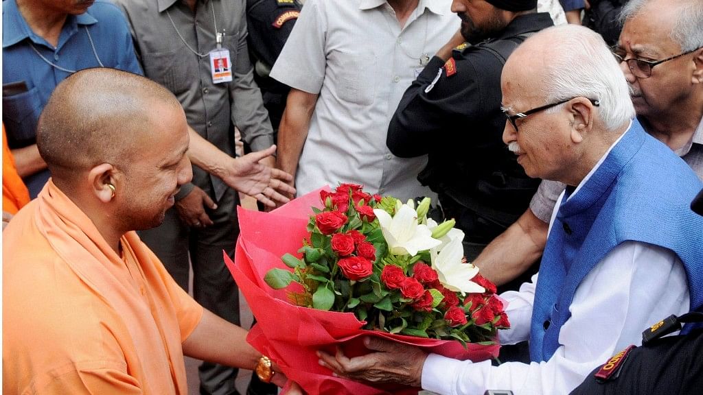Senior BJP leader LK Advani being greeted by Uttar Pradesh Chief Minister Yogi Adityanath at the VIP Guest House in Lucknow on Tuesday. Advani appeared before a special Central Bureau of Investigation (CBI) court in connection with the Babri Masjid demolition case. (Photo: PTI )