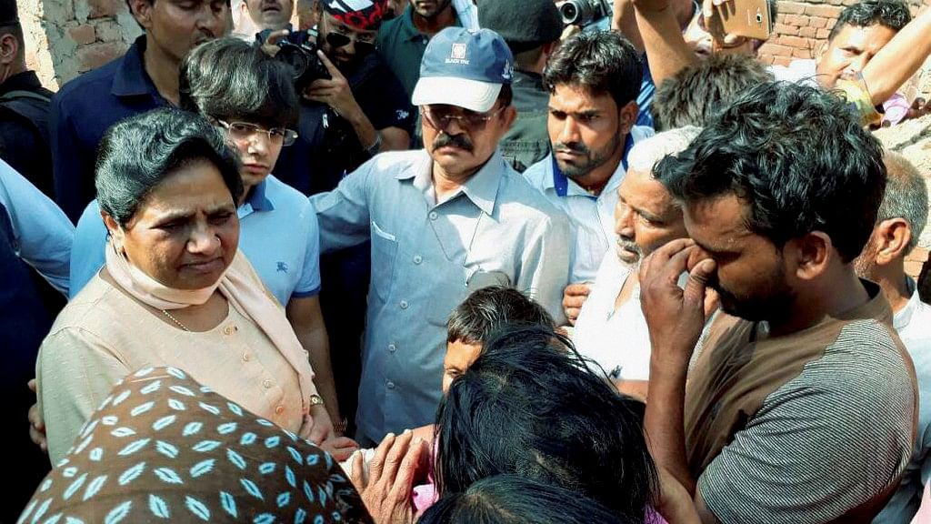 File photo of BSP chief Mayawati interacting with violence-hit people in Sabbeerpur village in Saharanpur district.