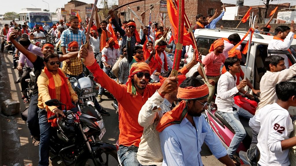 A file photo of Hindu Yuva Vahini vigilante members taking part in a rally in Unnao in April 2017. The body was founded in 2002 by Uttar Pradesh Chief Minister Yogi Adityanath. (Photo: Reuters)