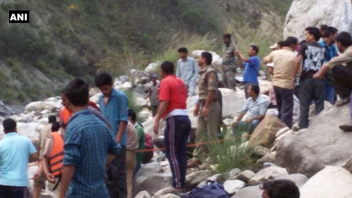 Rescue operations being carried out in Uttarkashi after a bus fell into a river. (Photo: PTI)