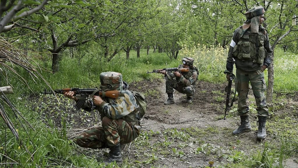 Indian Army personnel taking positions in an orchard during a crackdown on a village in South Kashmir’s Shopian district. Image used for representational purposes.