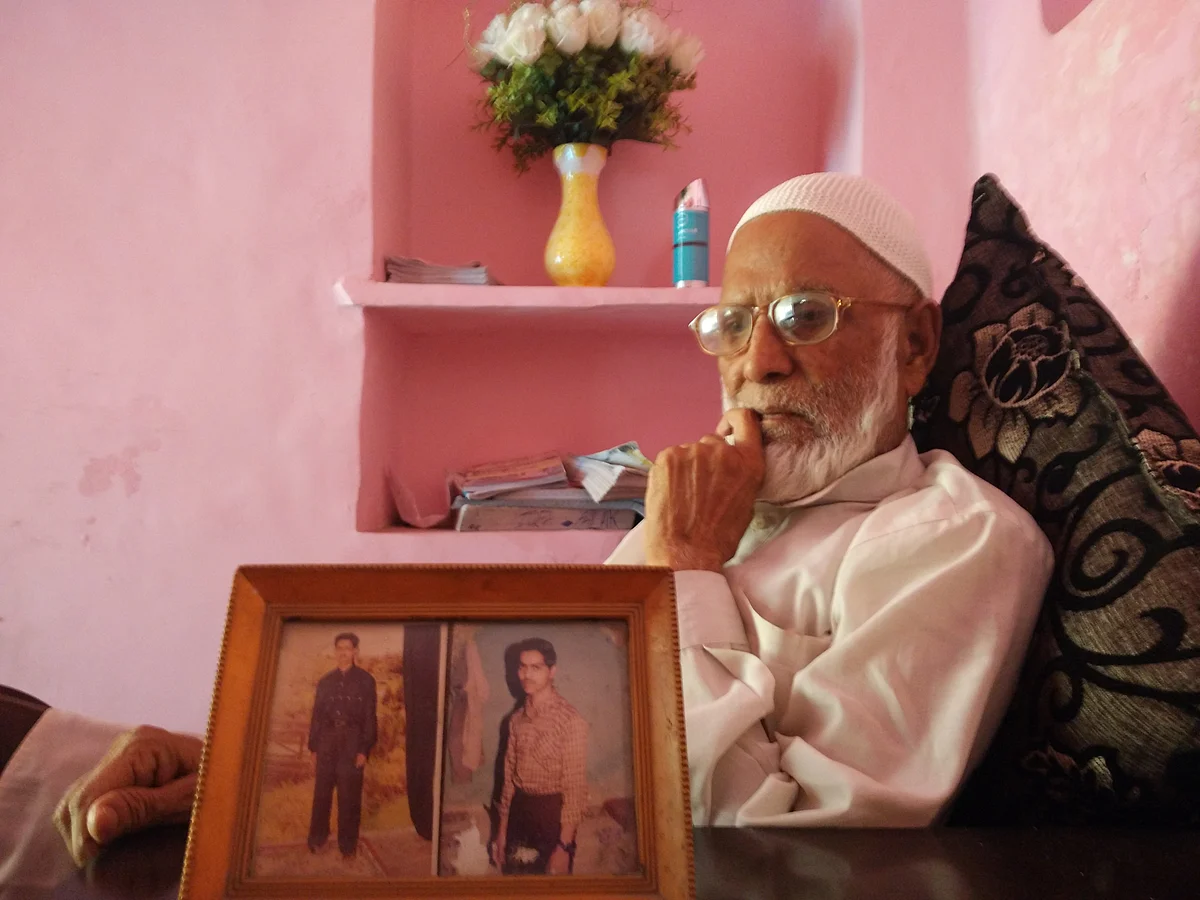 Jaffer with a picture of his sons, Mehtab on the right. (Photo Courtesy: Mahtab Alam)