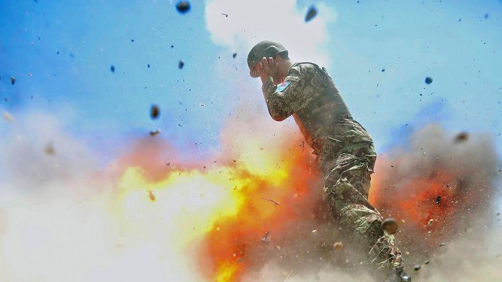 An Afghan soldier engulfed in flame as a mortar tube explodes during the Afghan National Army live-fire training exercise. (Photo: AP)