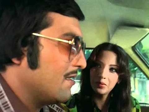 Vinod Khanna and Shabana Azmi in a scene from <i>Amar Akbar Anthony</i> (1977).