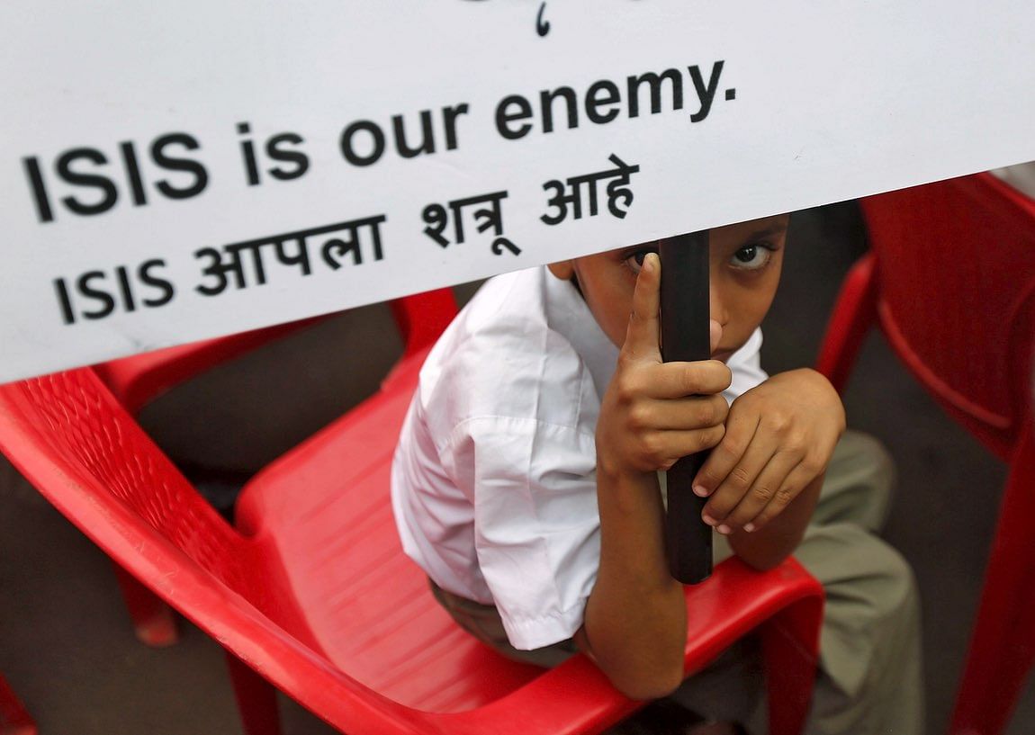 A participant at a rally organised by a Muslim charitable trust in Mumbai on 26 November 2015. (Photo: Reuters)