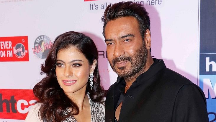 Kajol at an event with Ajay Devgn.&nbsp;