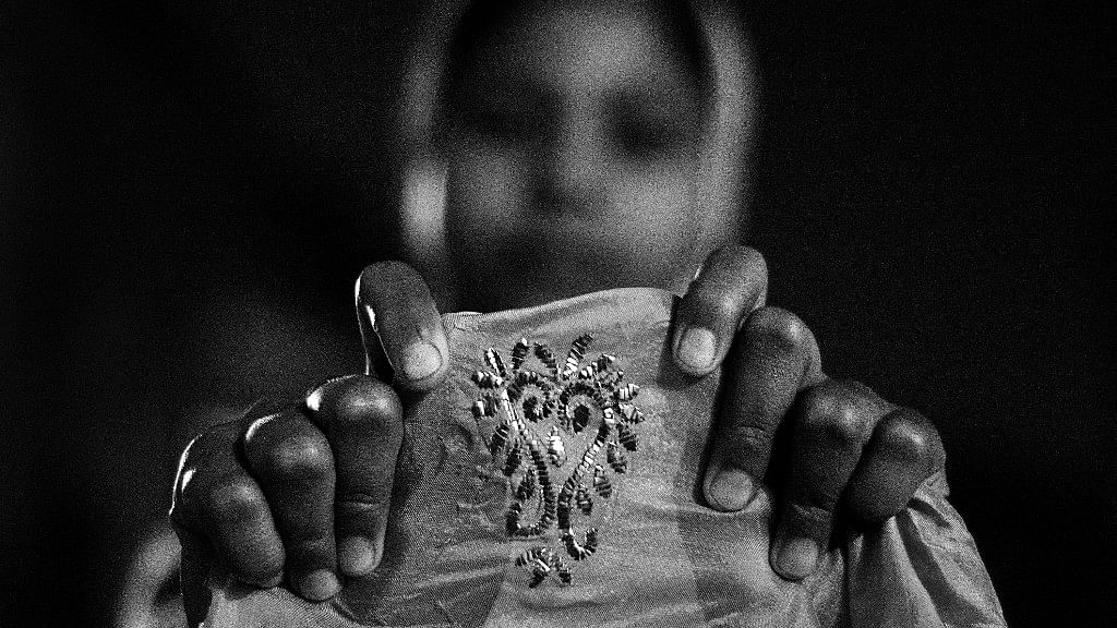 Eight years old, Ruqsana, granddaughter of a Badla artisan shows an intricate Mukaish embroidery crafted by her, in her family workshop situated at Deorhi Agha Meer, Old Lucknow, Uttar Pradesh. (Photo Courtesy: Taha Ahmad)