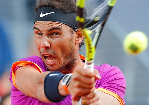 Rafael Nadal plays a shot in the final of the Madrid Open tennis tournament against Dominic Thiem, in Madrid, Spain. (Photo: AP)