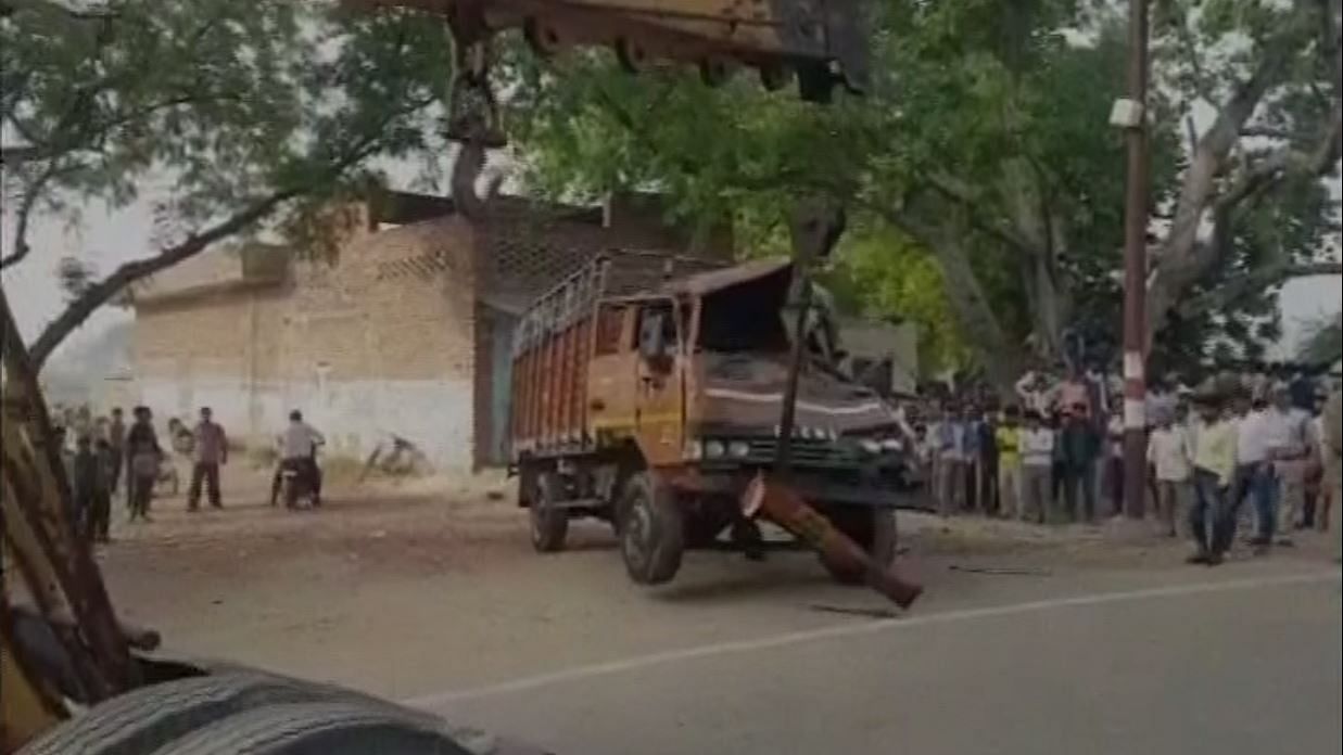 The truck being carried away from the scene. (Photo: ANI)