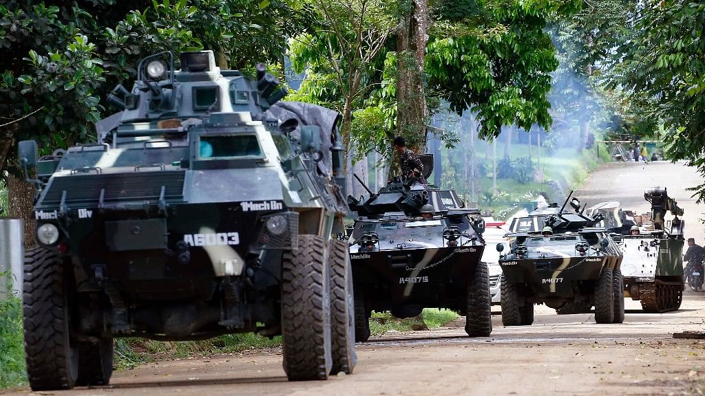 A convoy of APCs head to the site to combat with Muslim militants, three after the latter lay siege in Marawi city in southern Philippines. (Photo Courtesy: AP)&nbsp;