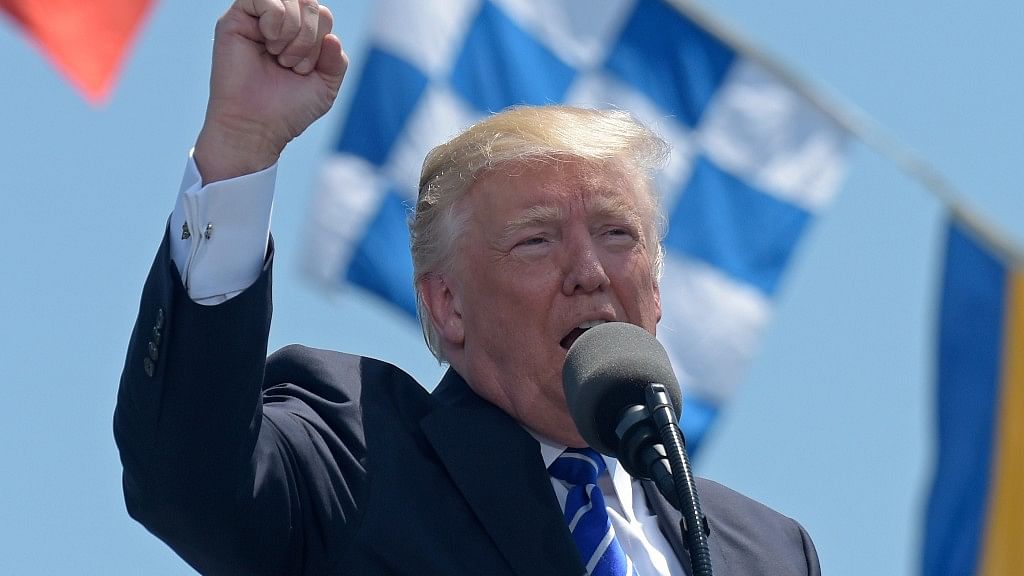US President Donald Trump gestures as he gives the commencement address at the US Coast Guard Academy in New London.