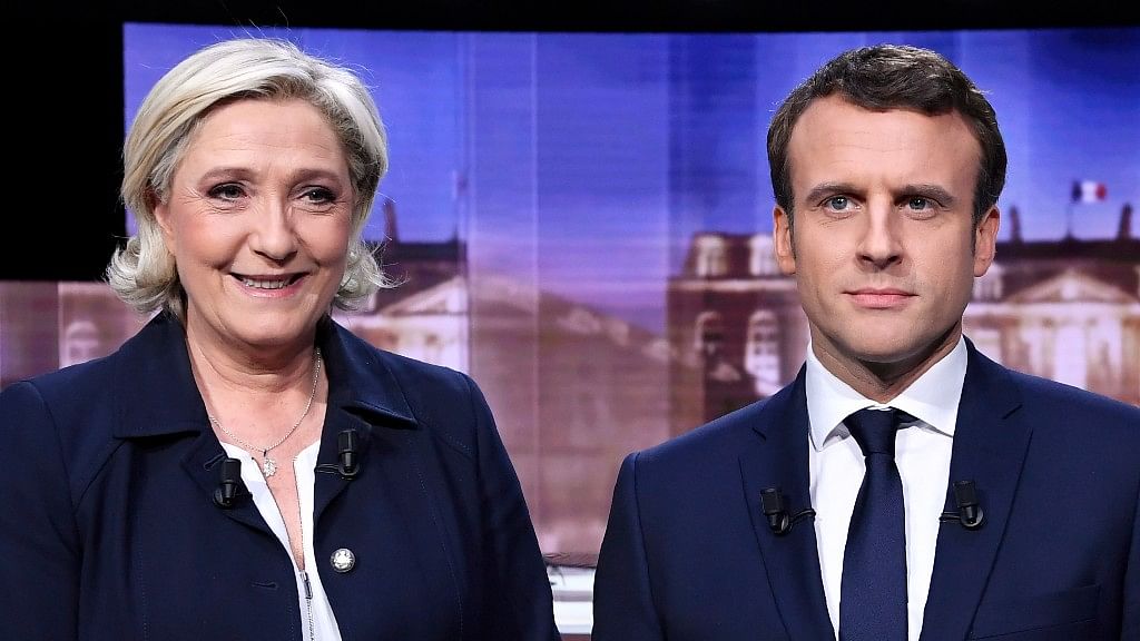 French presidential election candidate for the far-right Front National party, Marine Le Pen, left, and French presidential election candidate for the En Marche ! movement, Emmanuel Macron. (Photo: AP)