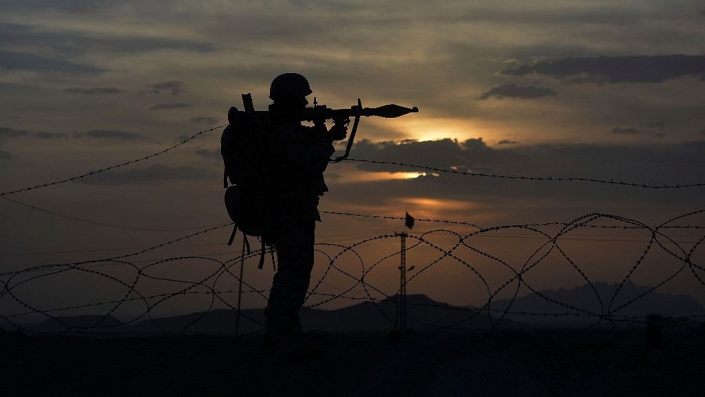 A Pakistani border security guard stands alert at Pakistan-Afghanistan border post, Chaman in Pakistan.