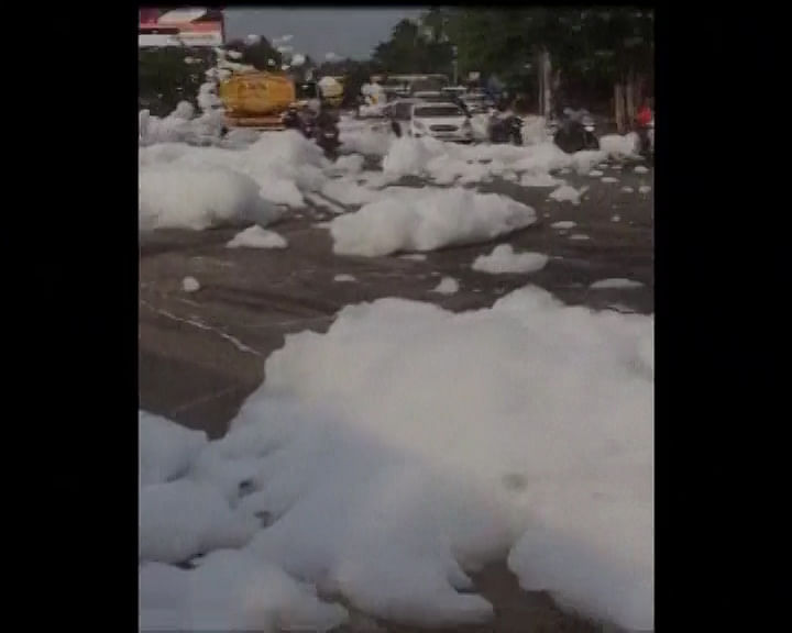 Highly toxic froth from lakes in Bengaluru overflows onto the streets, causing traffic disruptions.