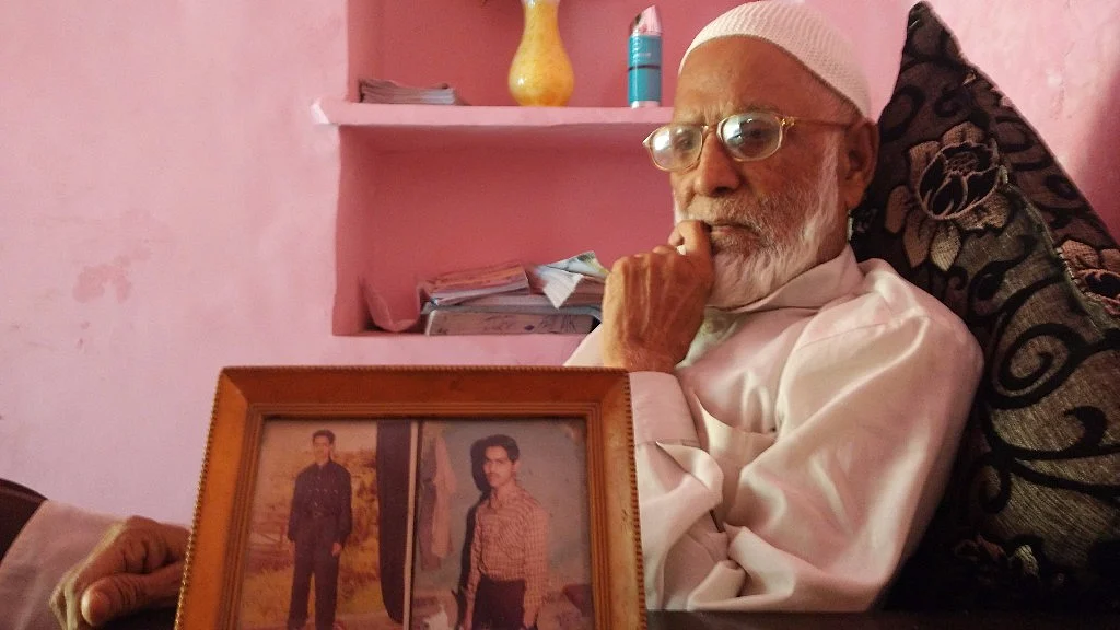Jaffer with a picture of his sons, Mehtab on the right. (Photo Courtesy: Mahtab Alam)