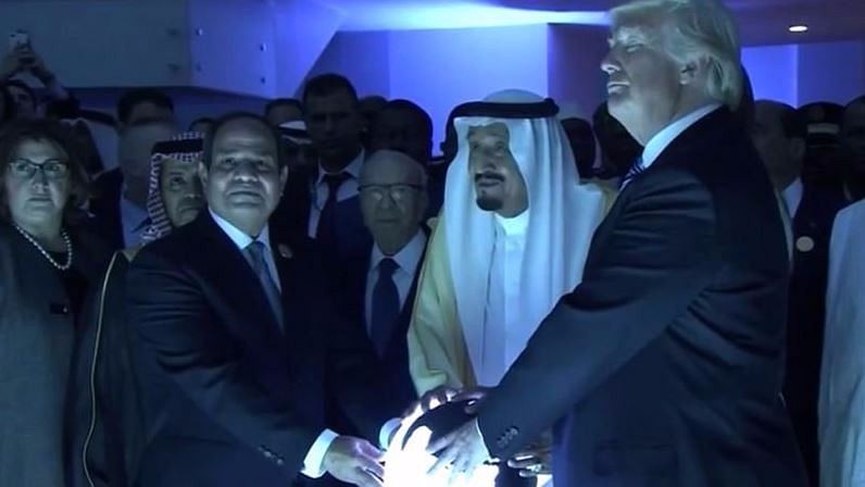 The three leaders with their hands on the globe at the opening ceremony of the Global Center for Combating Extremist Ideology (Photo Courtesy: Twitter/<a href="https://twitter.com/Politics_PR/status/866505592277434369">@Politics_PR</a>)
