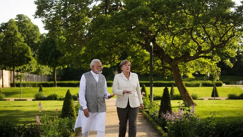 Prime Minister Narendra Modi with German Chancellor Angela Merkel. (Photo: AP)