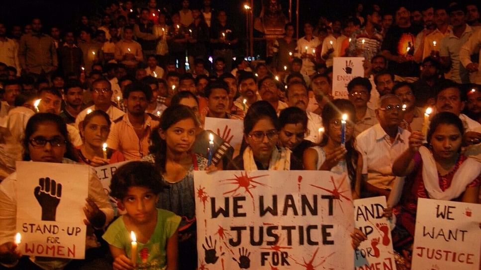 A file photo of an anti-rape candle march.&nbsp;