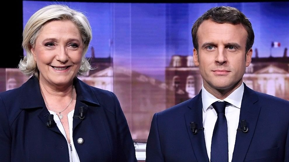 French presidential election candidate for Front National party, Marine Le Pen, left, and president-elect Emmanuel Macron. (Photo: AP)