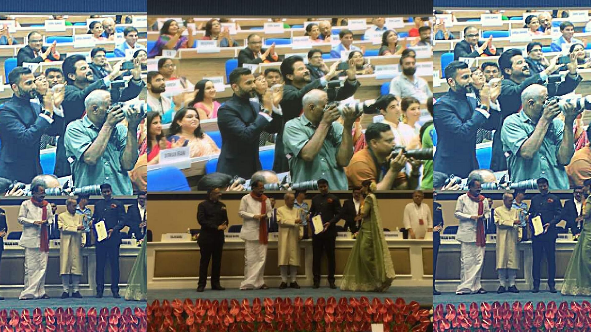 

Anil Kapoor takes pictures as Sonam receives her award. (Photo courtesy: <a href="https://twitter.com/AnilKapoor/status/859789136911245312">Twitter/ anilkapoor</a>)