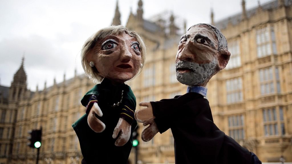 

Two anti-Brexit activists pose with their hand-puppets depicting British Prime Minister and leader of the Conservative party Theresa May and Britain’s Labour party leader Jeremy Corbyn. (Photo: AP)&nbsp;