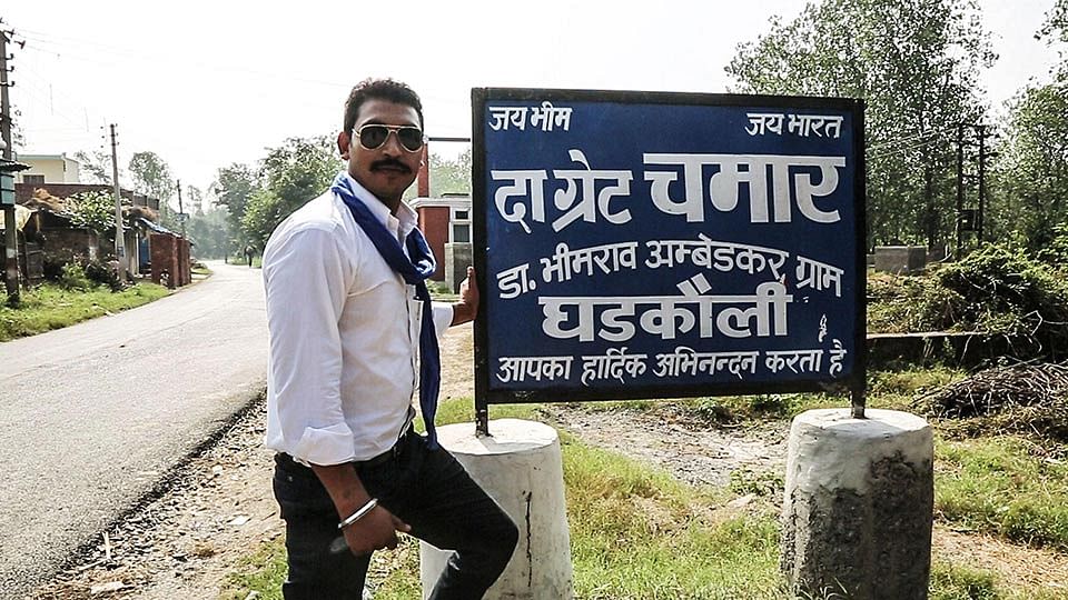 Chandrashekhar in Gharkoli with the signboard that launched his Bhim Army. 